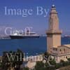 Historic Porto Pi lighthouse and Queen Mary 2 cruise ship.